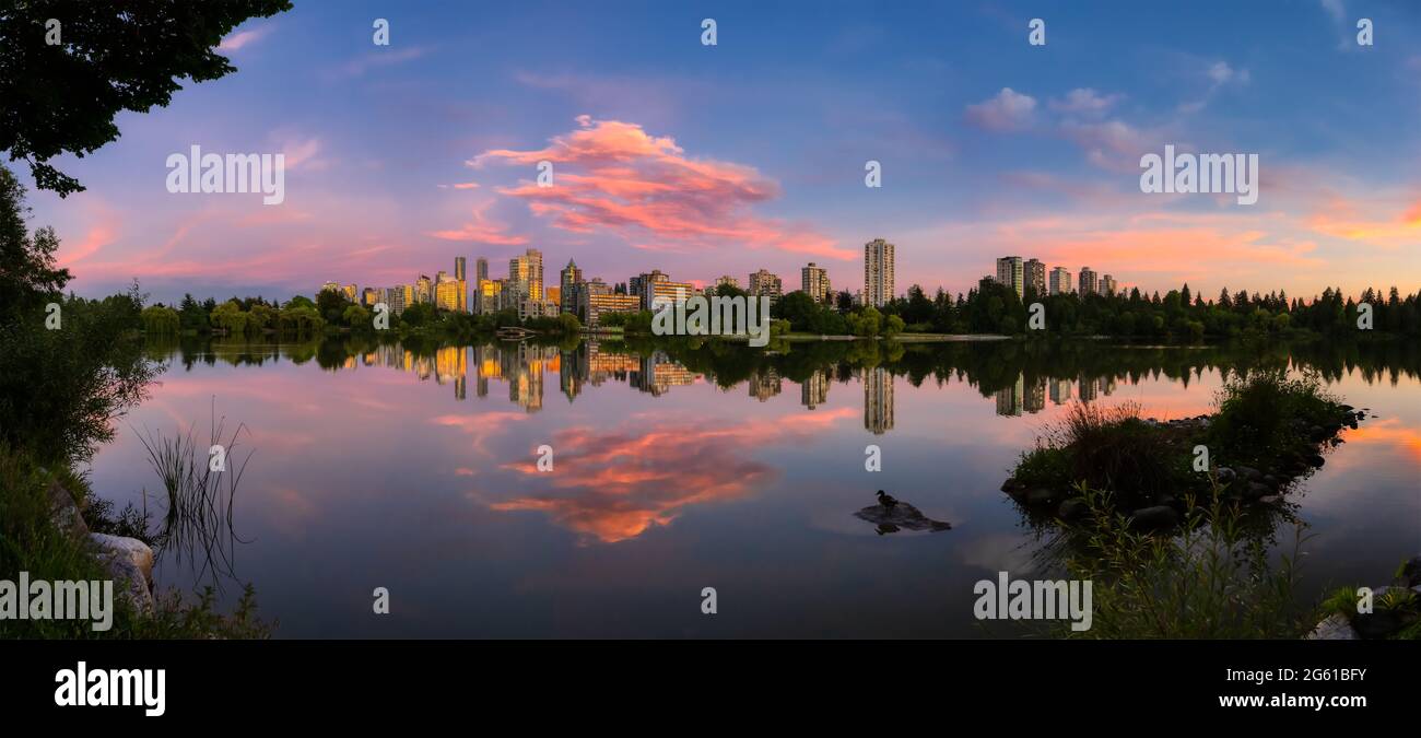 Lost Lagoon in famous Stanley Park in a modern city Stock Photo