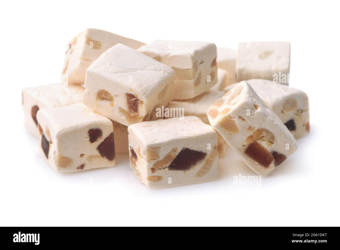 Heap of nougat with dried fruit and nut isolated on white Stock Photo