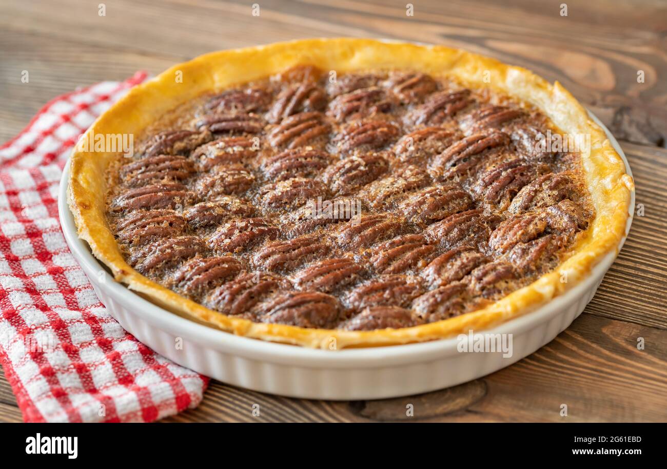 Pecan pie - traditional southern US dessert on wooden table Stock Photo