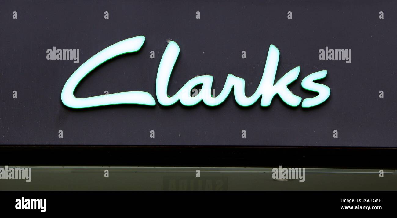C. & J. Clark International Ltd known as Clarks shoe retailer shop sign  close up Stock Photo - Alamy