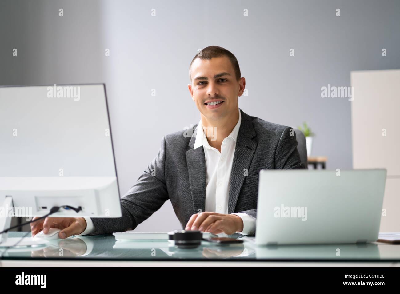 Pro At Using Computers Professional using computer in office hi-res stock photography and ...
