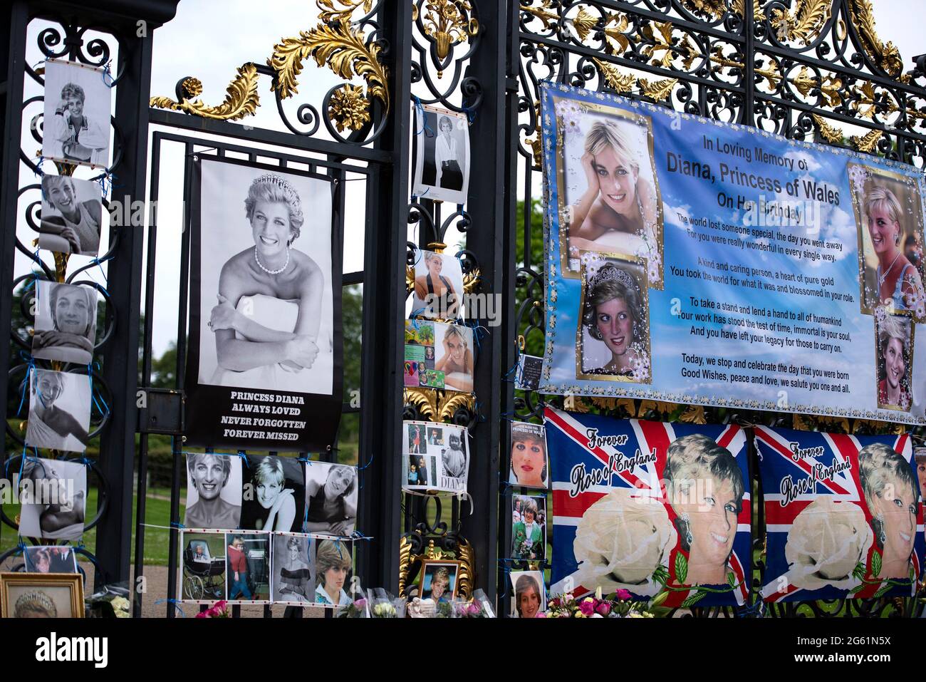 London, UK. 01st July, 2021. Memorial banner and photographs are displayed, during the commemoration.A ceremony took place in Kensington Gardens after the unveiling of Princess Diana's statue. July 1st would have been her 60th birthday. Credit: SOPA Images Limited/Alamy Live News Stock Photo