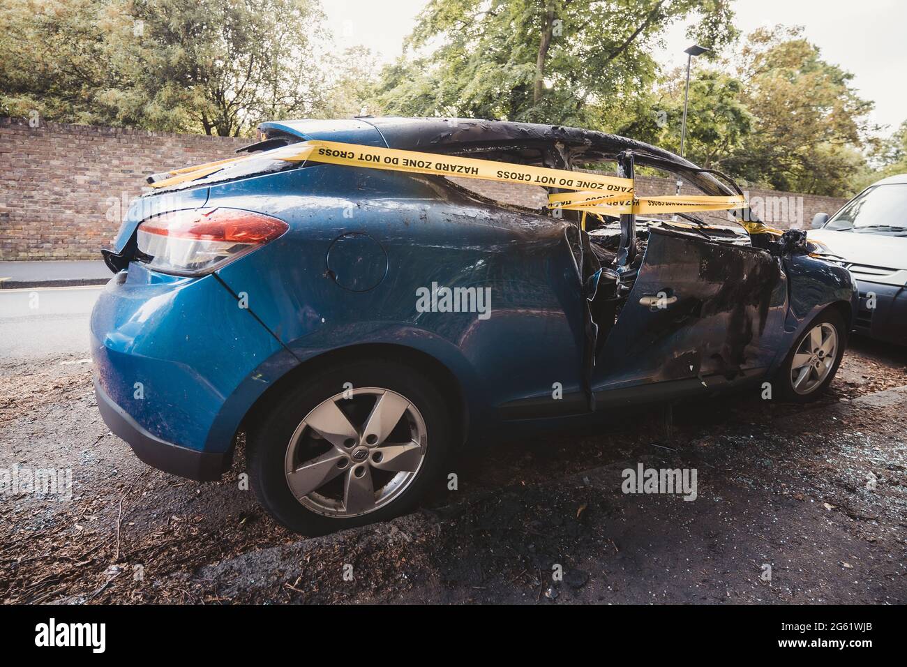 London UK 2021 06 12 An Abandoned Stolen Burnt Out Blue Car Parked On The Sideway Parking 