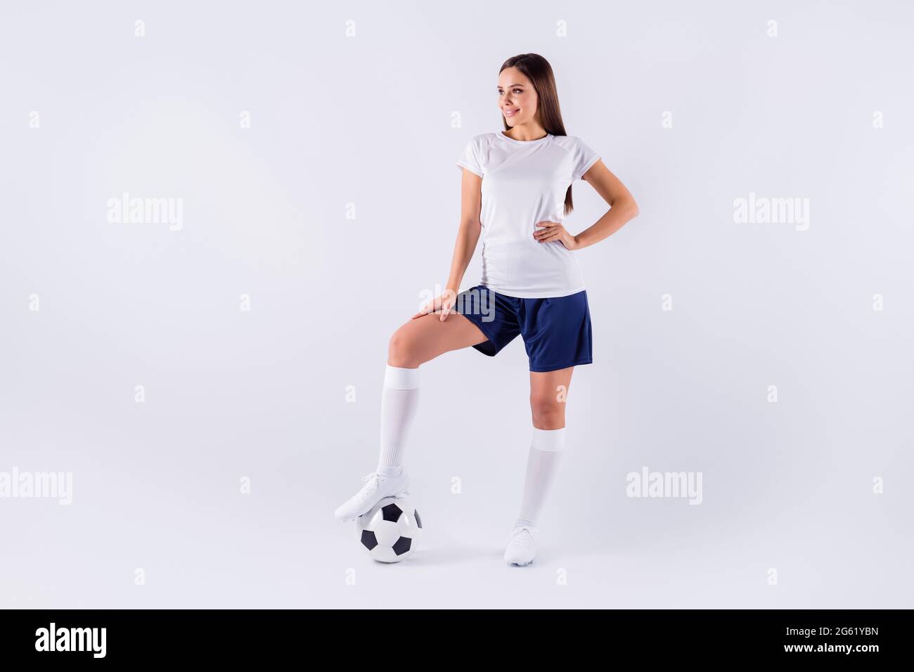 Full length body size view of her she nice-looking attractive lovely pretty slim cheerful straight-haired girl posing putting legs on ball isolated on Stock Photo