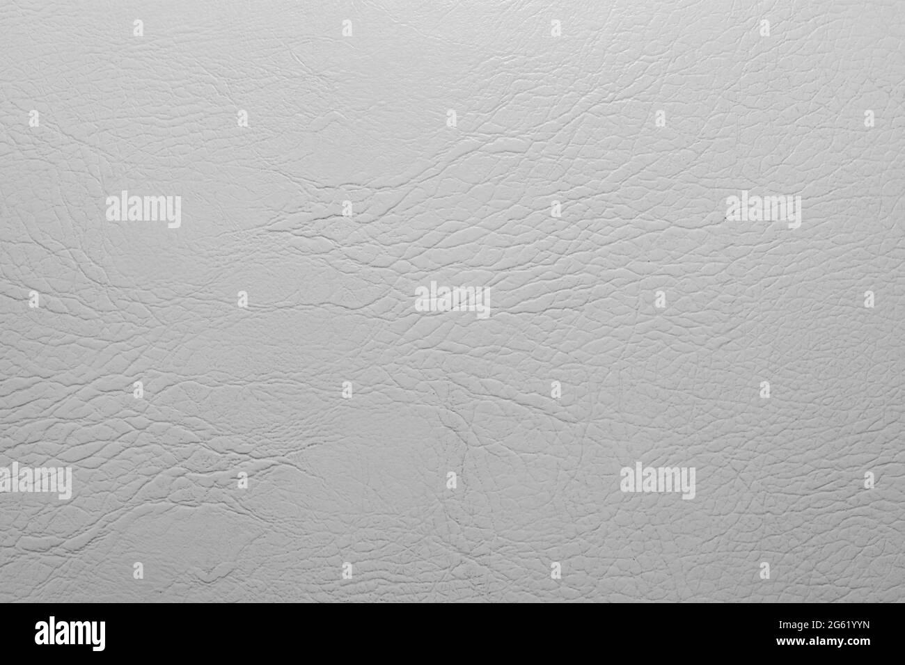 Texture photo of white or light grey colored leather surface backdrop. Stock Photo