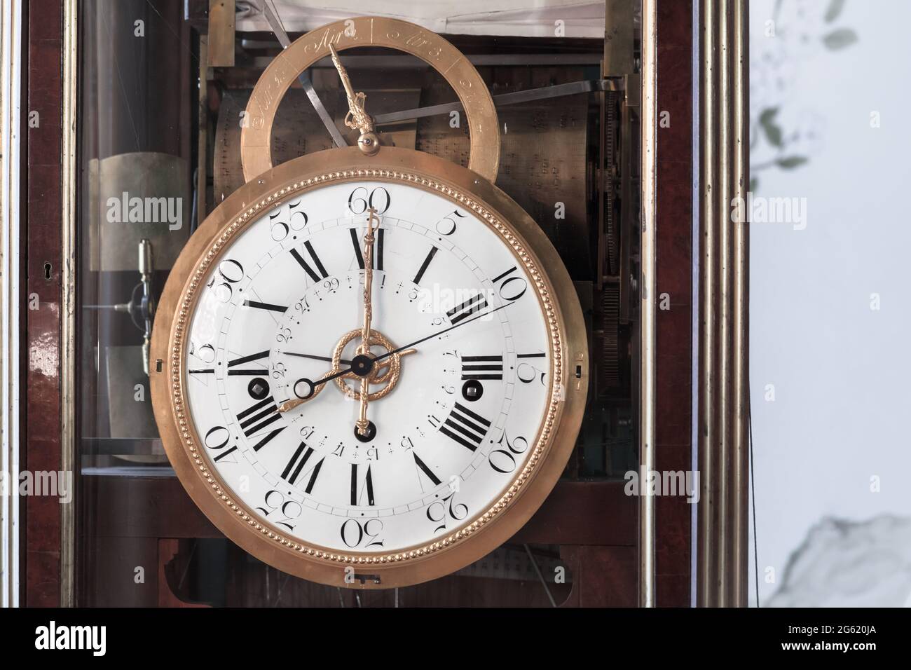 Vintage grandfather clock with white clock face. Close up photo Stock Photo