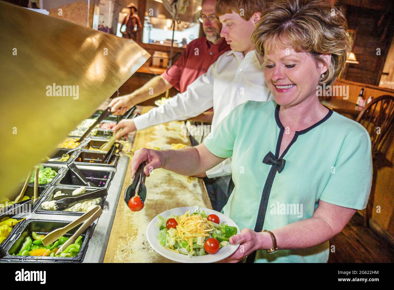 Alabama Moulton Western Sirloin Steakhouse buffet style food,all you can eat family restaurant self serve service woman, Stock Photo