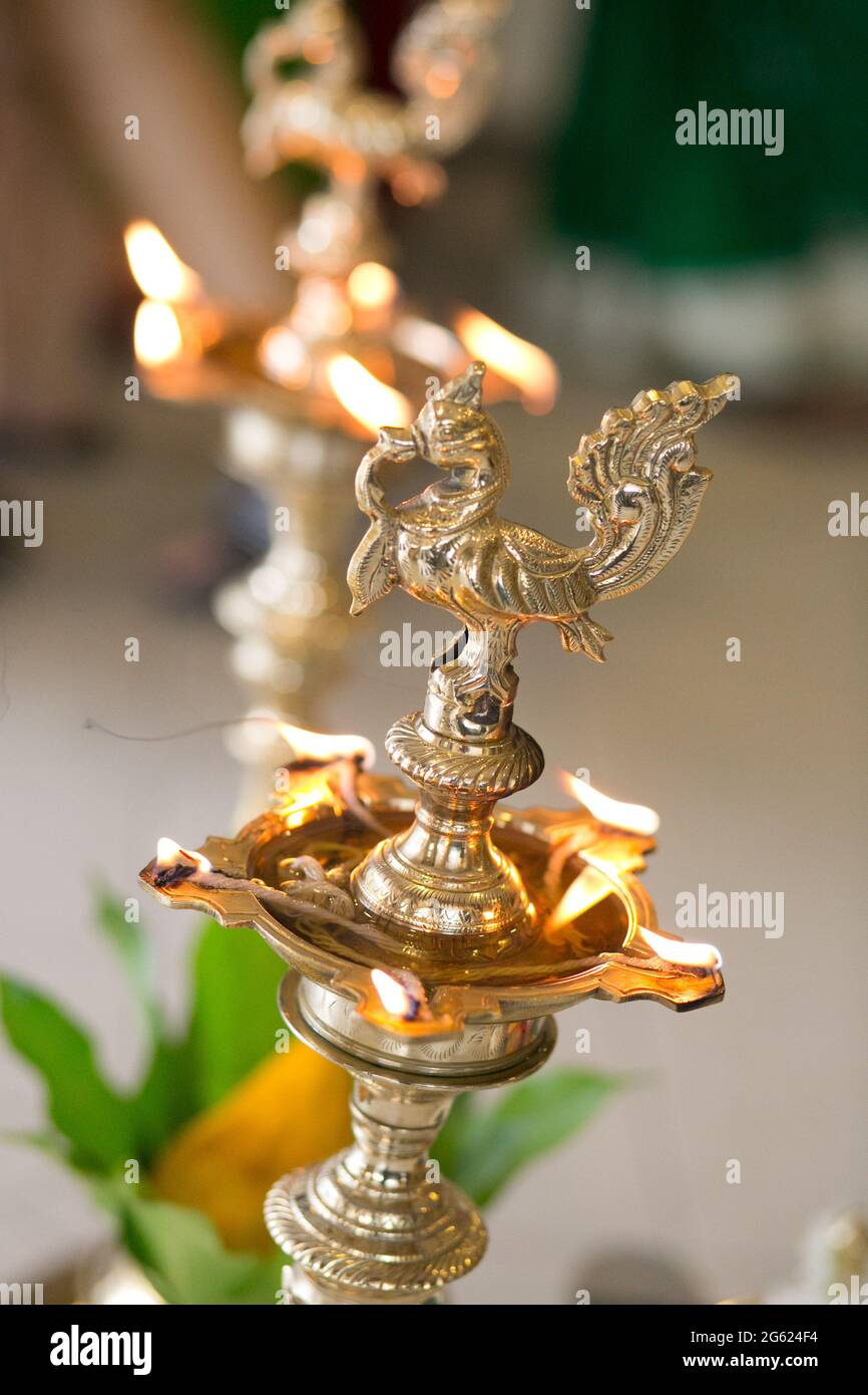 Traditional brass oil lamp during a Hindu wedding ceremony Stock