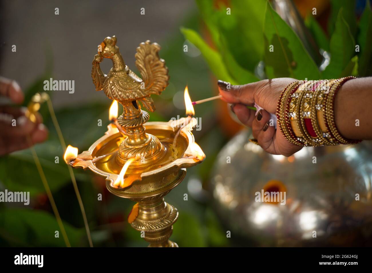 Traditional Indian brass oil lamp during a wedding ceremony Stock Photo