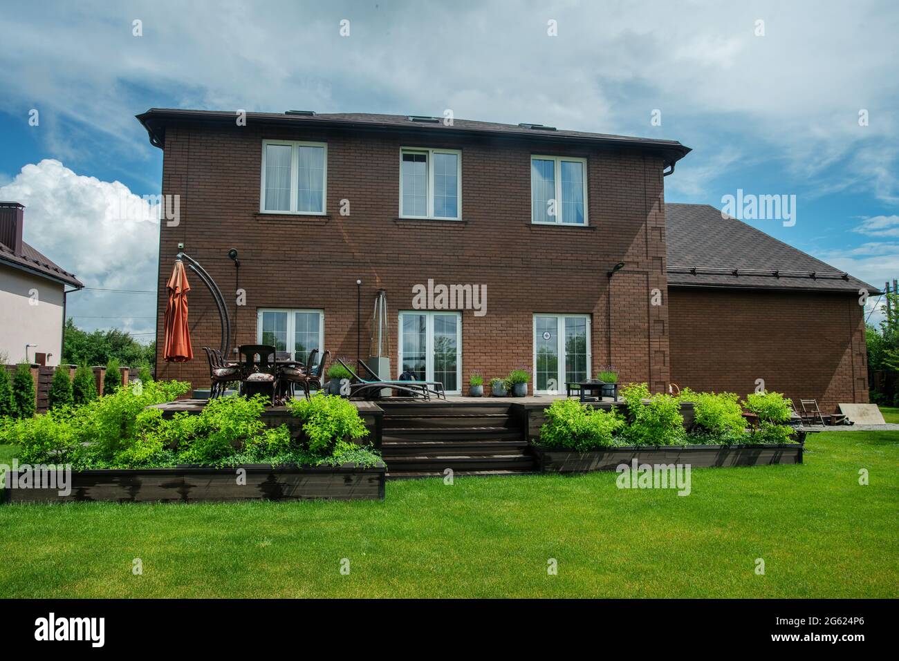 Typical russian dacha in Moscow oblast and garden next to , grass meadow.  Idylic  Mid summer in Russia! Stock Photo