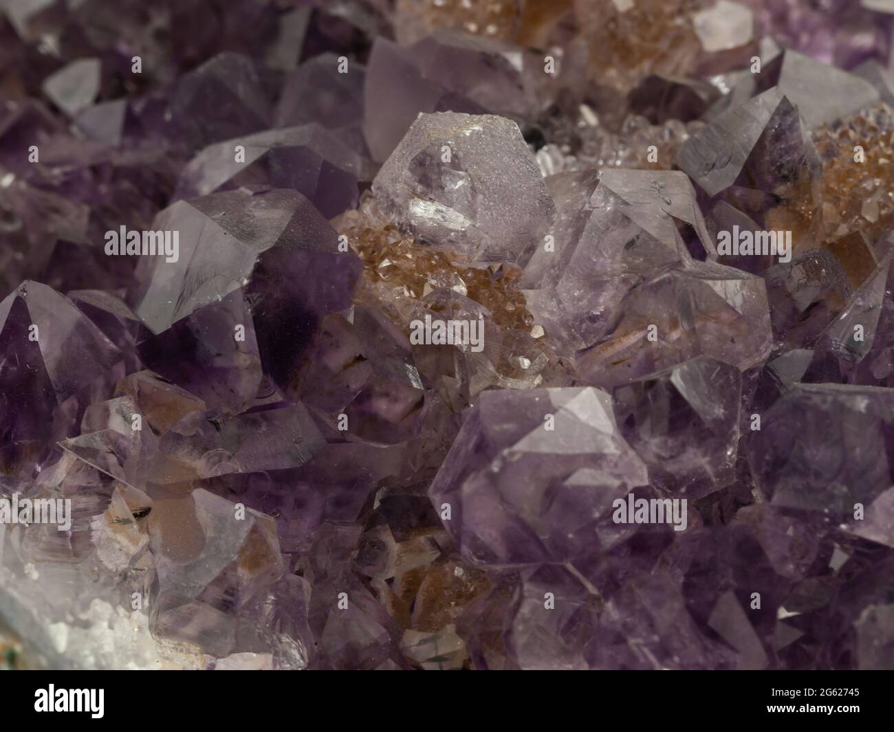 semi-transparent purple amethyst quartz crystals on matrix Stock Photo