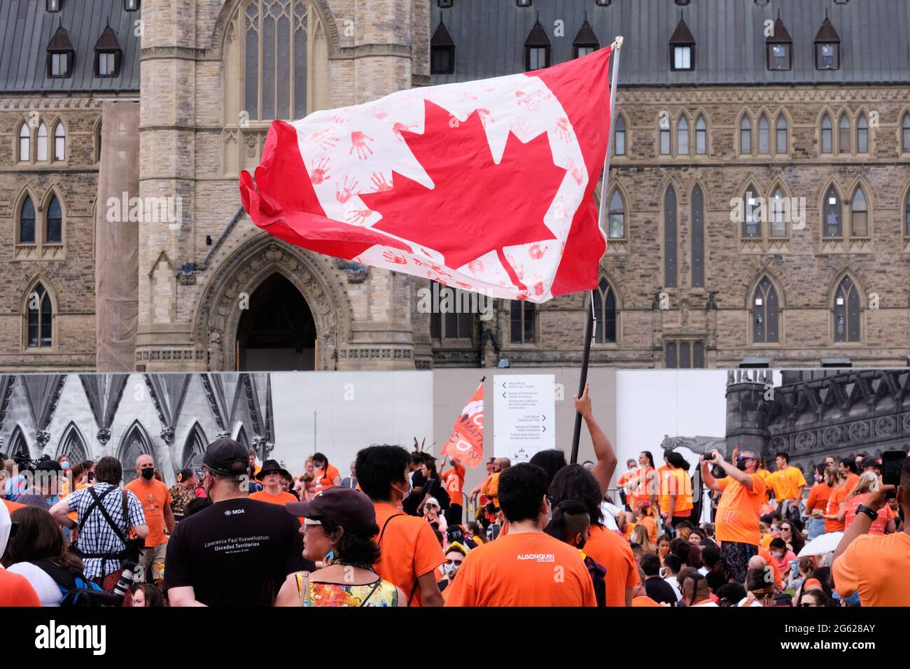 July 1st, 2021. Flag with bloody hand at Cancel Canada Day Indigenous rally  following discovery of unmarked children graves in Residential Schools Stock Photo