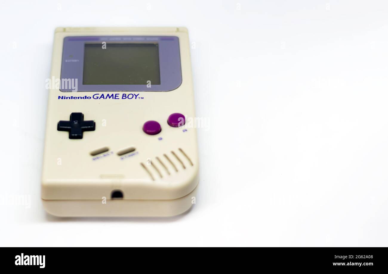 Rome, Italy, December 23, 2020: The Gameboy portable video game console from Nintendo isolated on a white background. Vintage video game console from Stock Photo