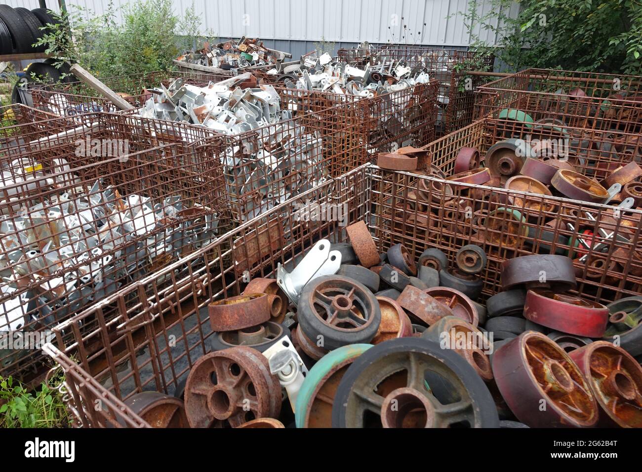 Bins of surplus scrap sit outside of Delaney's Surplus sales south of