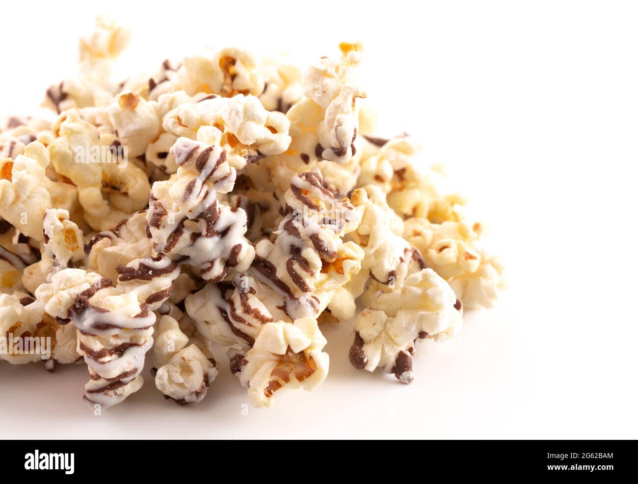 A Pile of White and Milk Chocolate Drizzled Sweet Popcorn Stock Photo