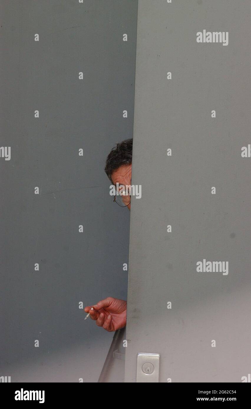 New York, NY, USA. 1st July, 2021. Joel Steinberg, shown here peeking out of a back door at The Fortune Academy.The disbarred NY City criminal defense attorney was convicted of manslaughter, in the November 1,1987, beating and subsequent death of six-year old girl, Elizabeth [''Lisa''] Launders, whom he and his live-in partner Hedda Nussbaum had illegally adopted. Credit: C. Neil Decrescenzo/ZUMA Wire/Alamy Live News Stock Photo