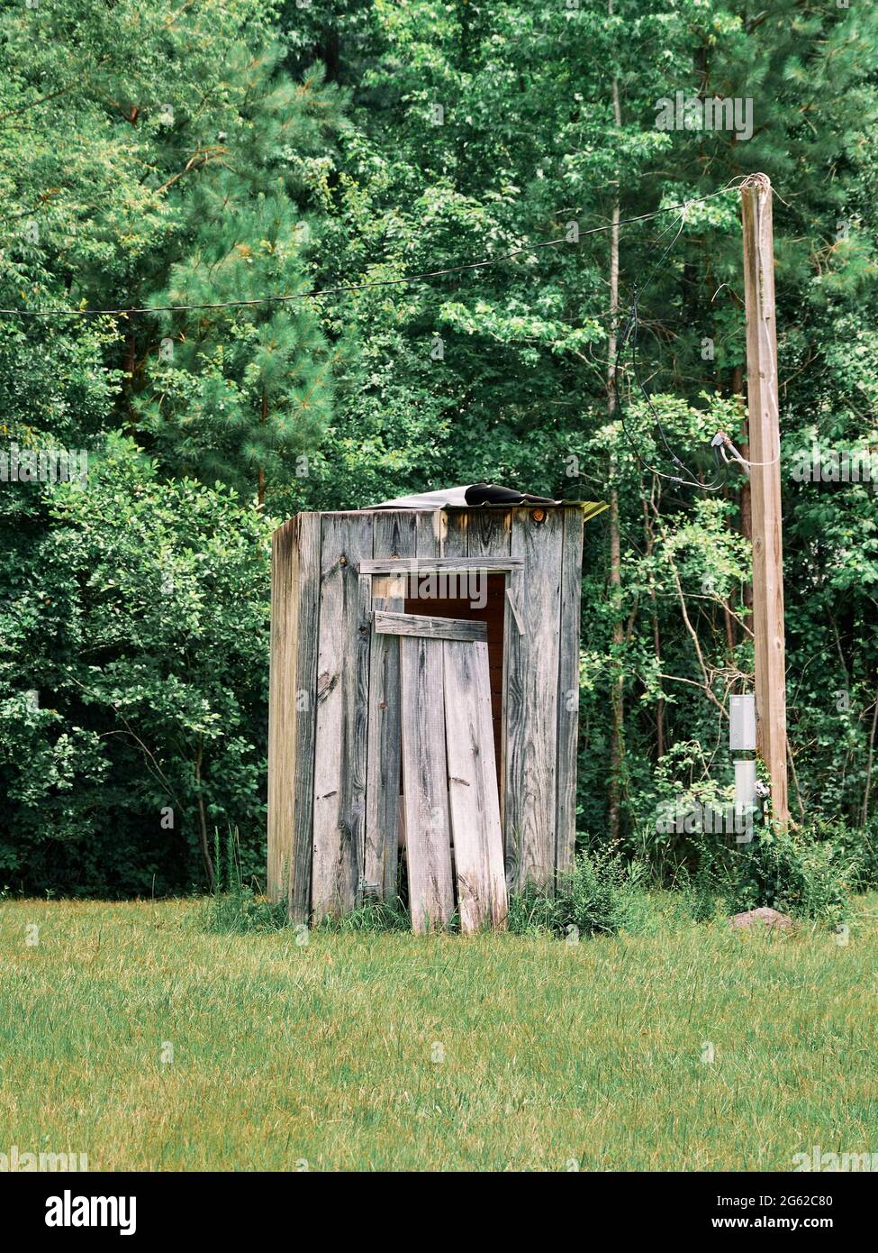Old wooden outhouse in rural Alabama, USA. Stock Photo