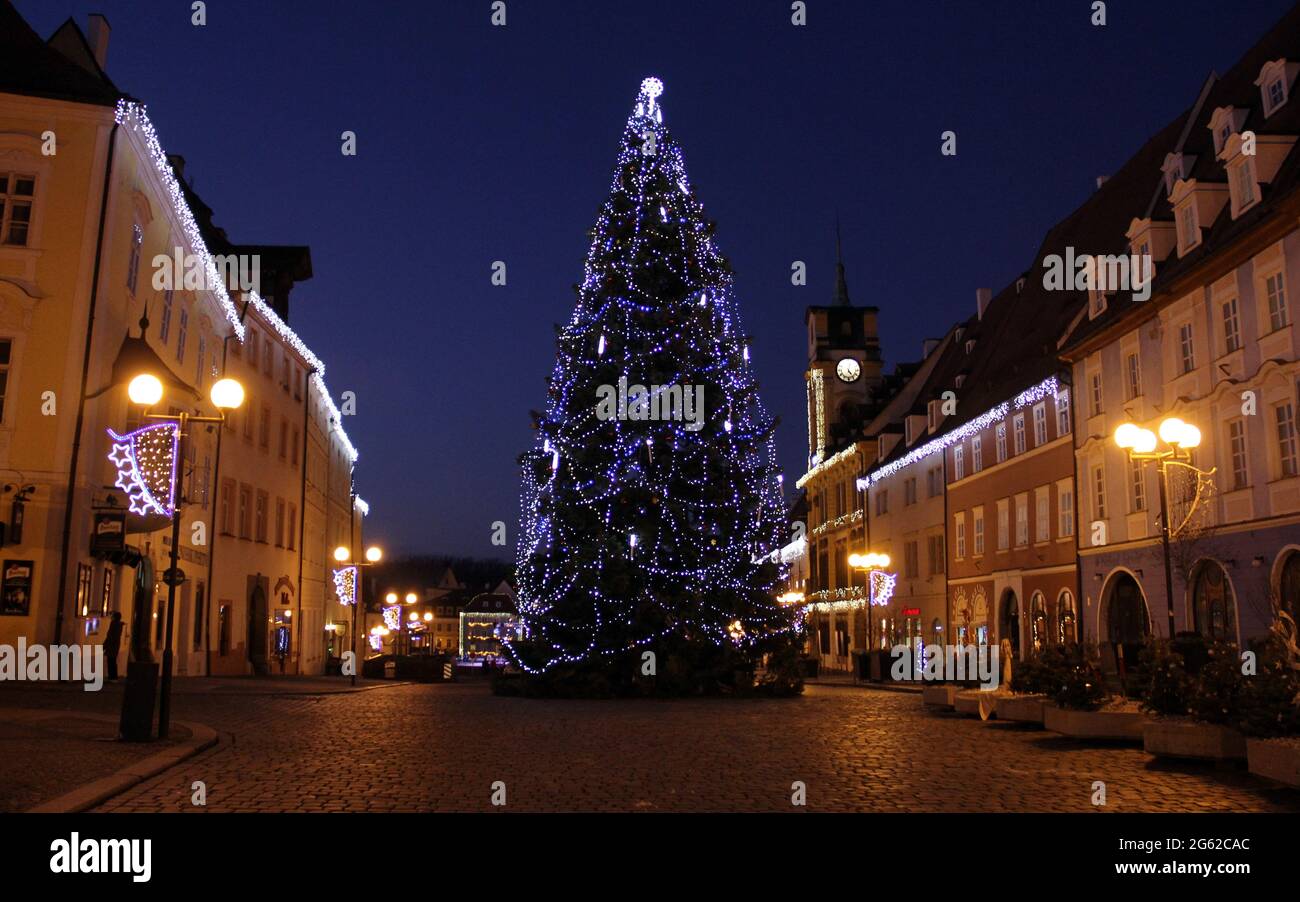 Christmas tree in the historic cobblestone town square, illuminated at