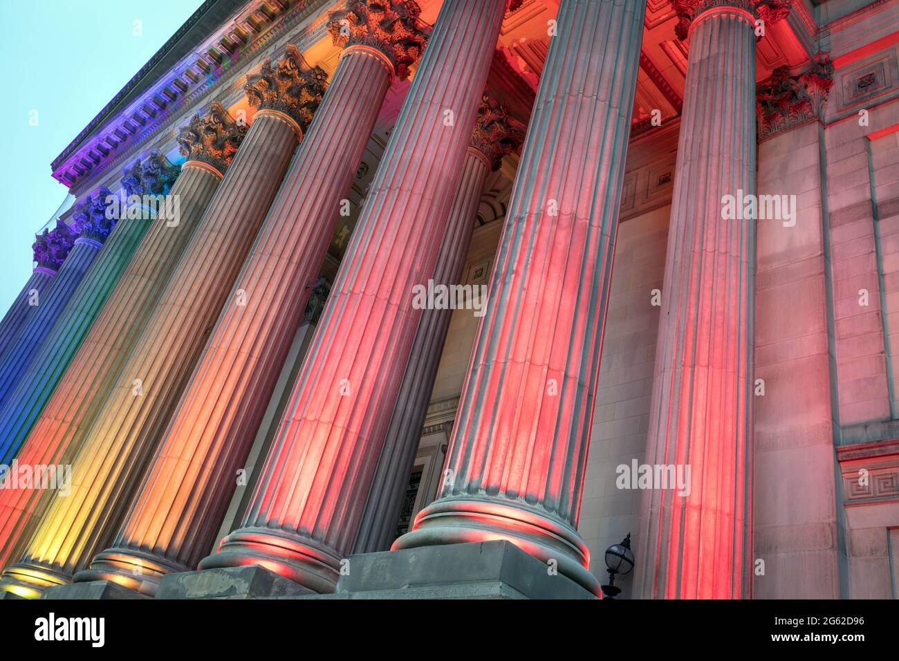 The southern facade of St George's Hall, Liverpool, floodlit in rainbow colours Stock Photo