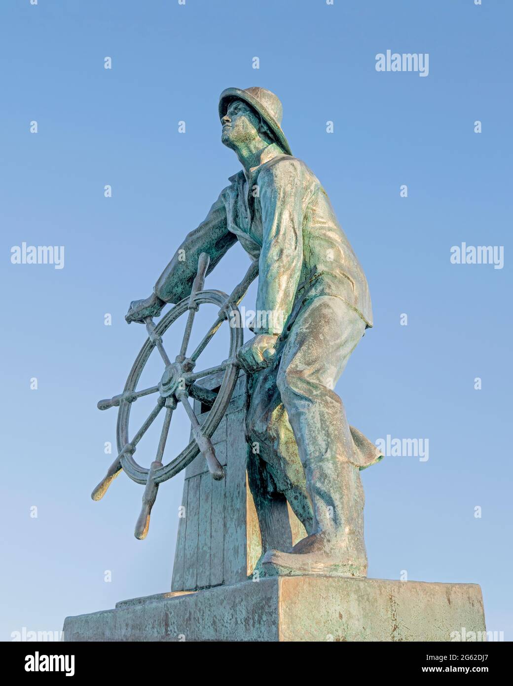 Gloucester, Massachusetts / United States - October 2, 2014: Gloucester Fisherman Memorial, an eight foot bronze staute designed by English sculptor L Stock Photo