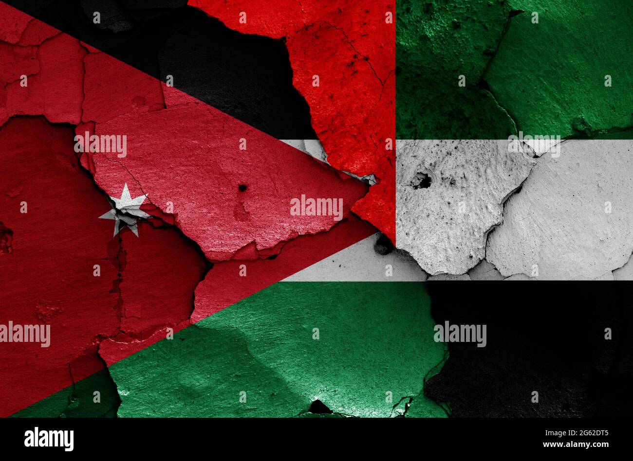 flags of Jordan and UAE painted on cracked wall Stock Photo Alamy