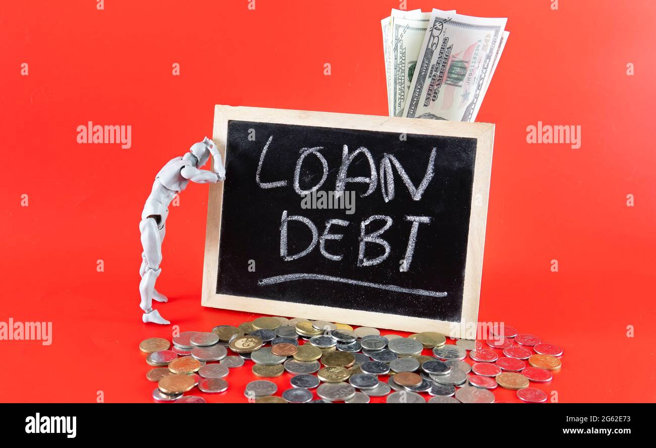 Financial problem concept. Loan Debt Concept. Selective focus on the board hand written loan debt Stock Photo