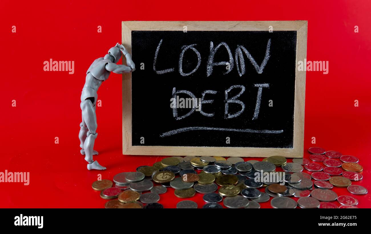 Financial problem concept. Loan Debt Concept. Selective focus on the board hand written loan debt Stock Photo