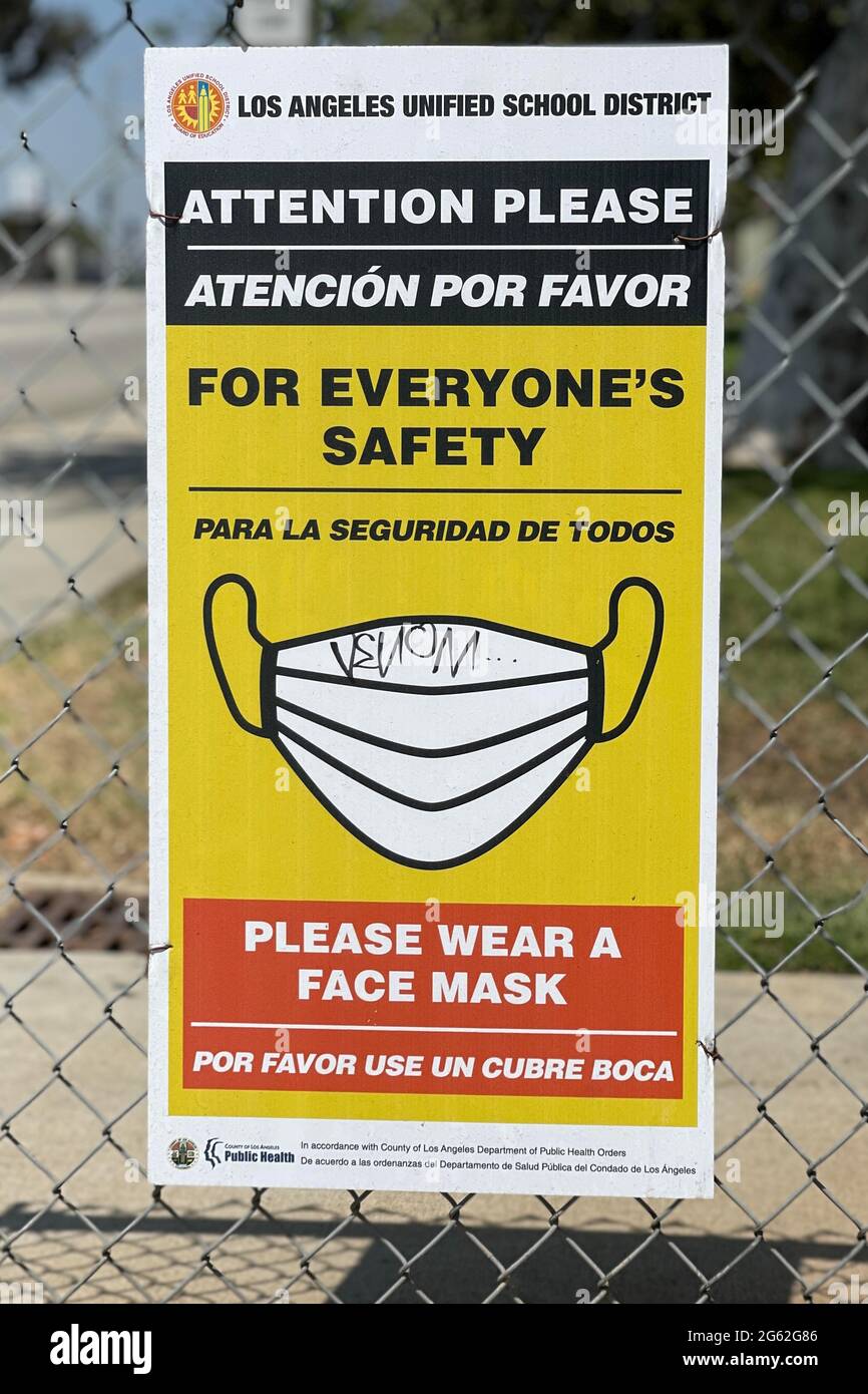 A Face Mask advisory sign with coronavirus COVID-19 safety precautions at Morris K. Hamasaki Elementary School, Thursday, July 1, 2021, in Los Angeles Stock Photo