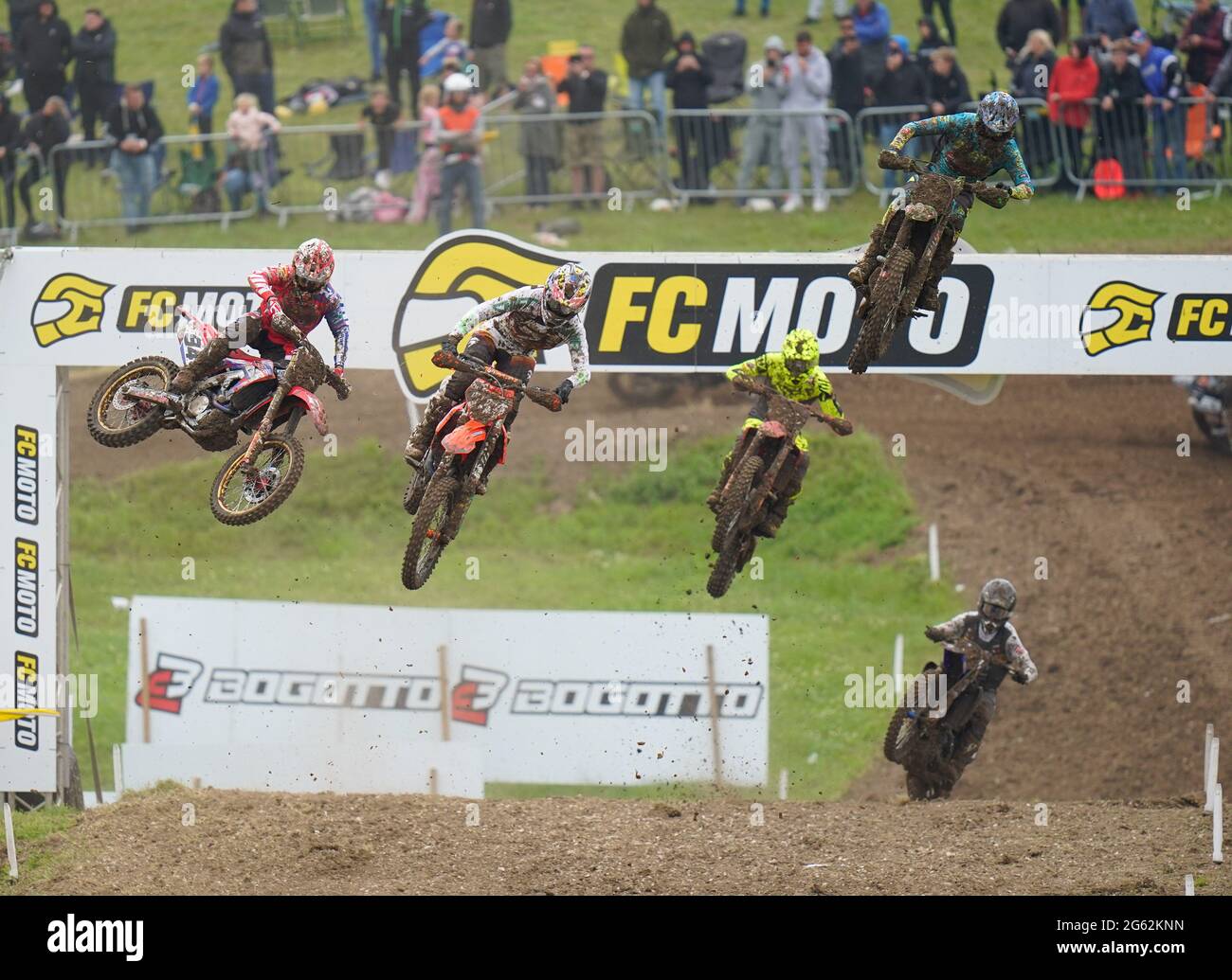 Riders make a jump during MX2 Race 1 in the British leg of the 2021 FIM MotoCross World Championships on Sunday, June 27, 2021, at Matterley Basin, Wi Stock Photo