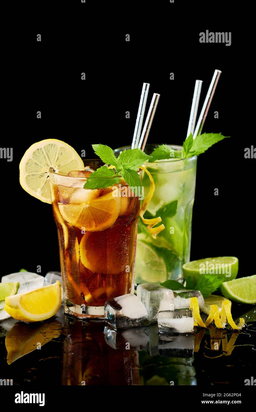 https://c8.alamy.com/comp/2G62PG4/glass-of-fresh-long-island-ice-tea-and-mojito-cocktail-studio-shot-on-black-background-2G62PG4.jpg