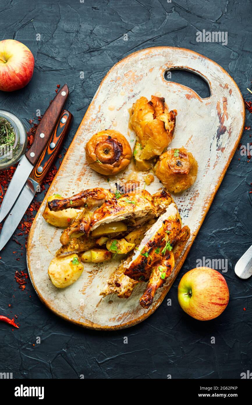 Chicken baked in apples,sliced on a kitchen board Stock Photo
