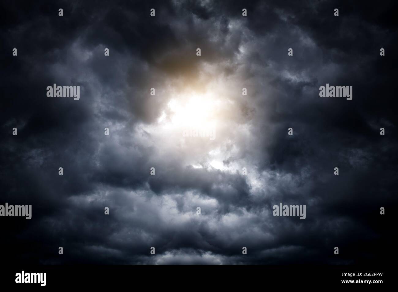 Light in the Dark and Dramatic Storm Clouds Stock Photo - Alamy