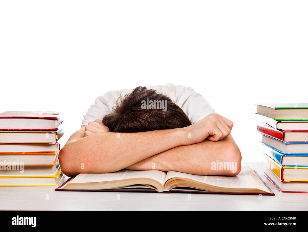 Tired Student sleep on the Book on the White Background Stock Photo