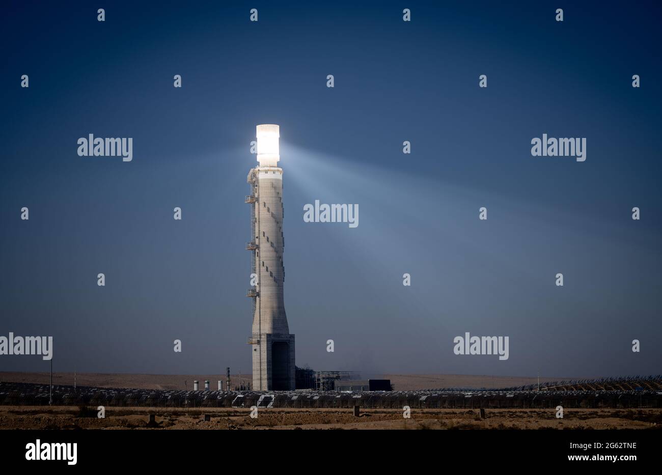 Negev, Israel. 02nd July, 2021. A 240-meter-high solar tower, also called "Sauron's Eye," stands in Israel's Negev Desert about 40 kilometers from Be'er Sheva. The tower is surrounded by over 50,000 computer-controlled heliostats. Sunlight is directed to the top of the tower over an area of 3.15 square kilometres. German President Steinmeier is in Israel for a three-day state visit, visiting Negev today. Credit: Kay Nietfeld/dpa/Alamy Live News Stock Photo