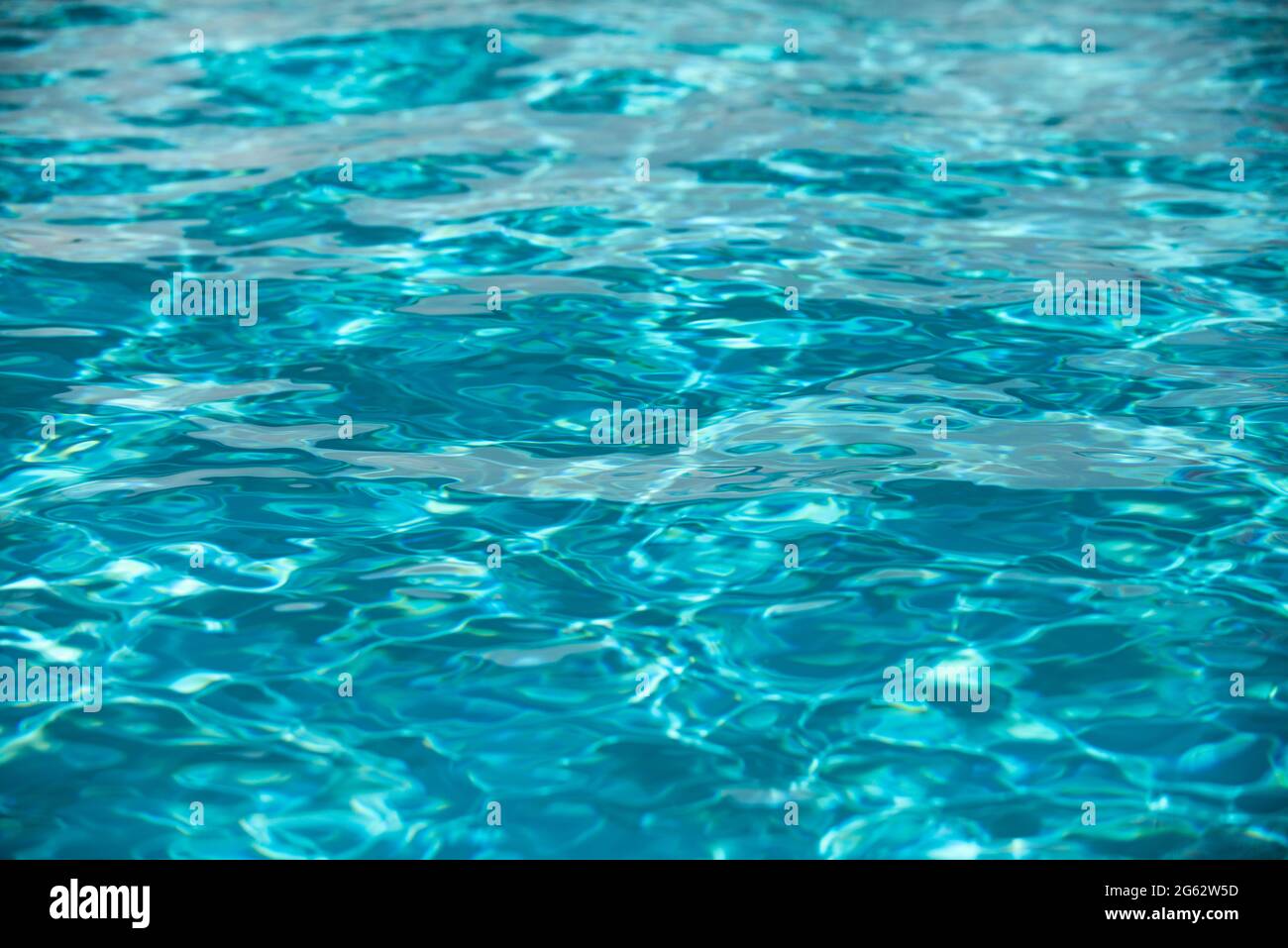 Abstract ripple wave and clear turquoise water surface in swimming pool ...