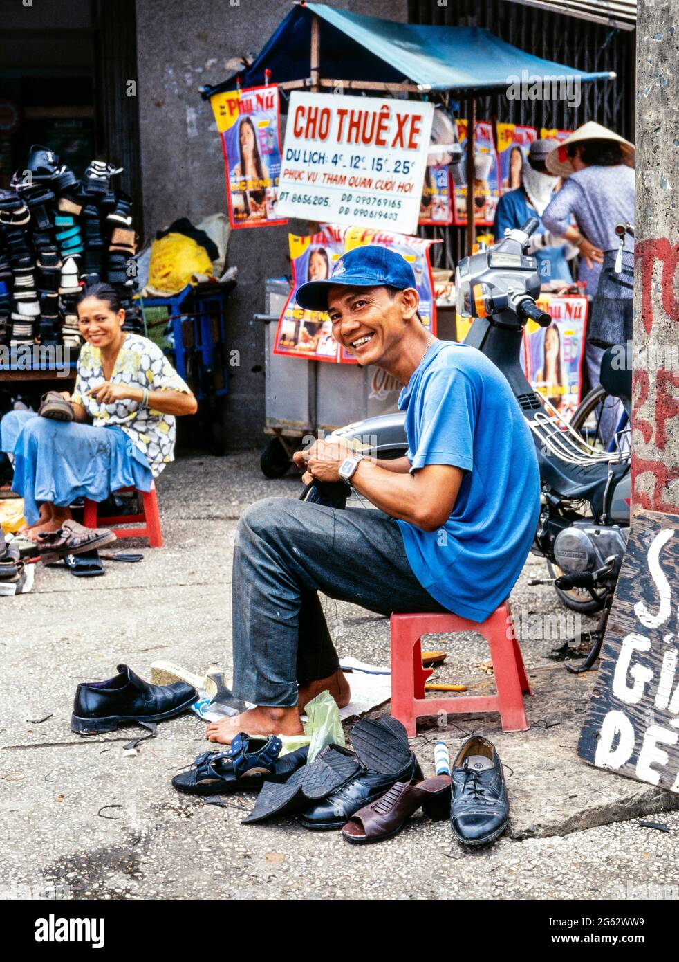 Shoe repair on the street, Saigon, Ho Chi Minh city, Vietnam Stock Photo