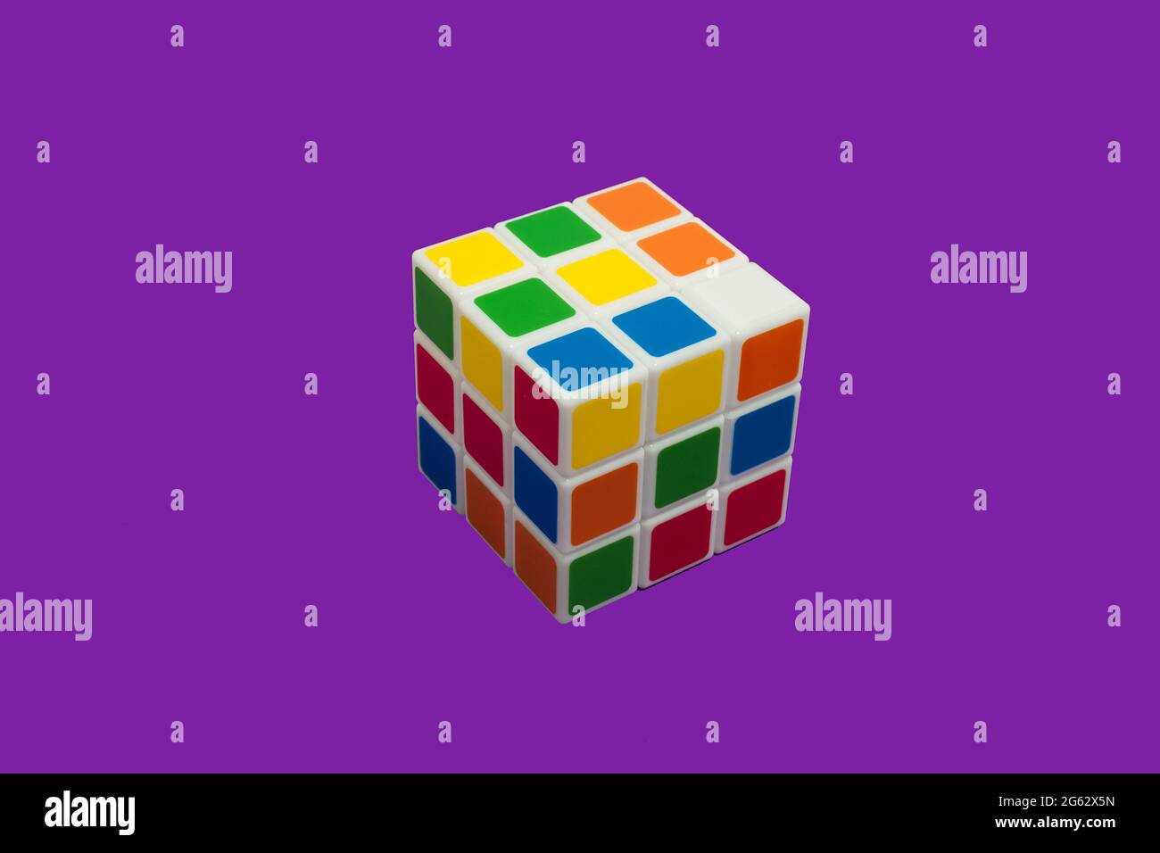 Rubiks Cube on a purple background isolated Stock Photo