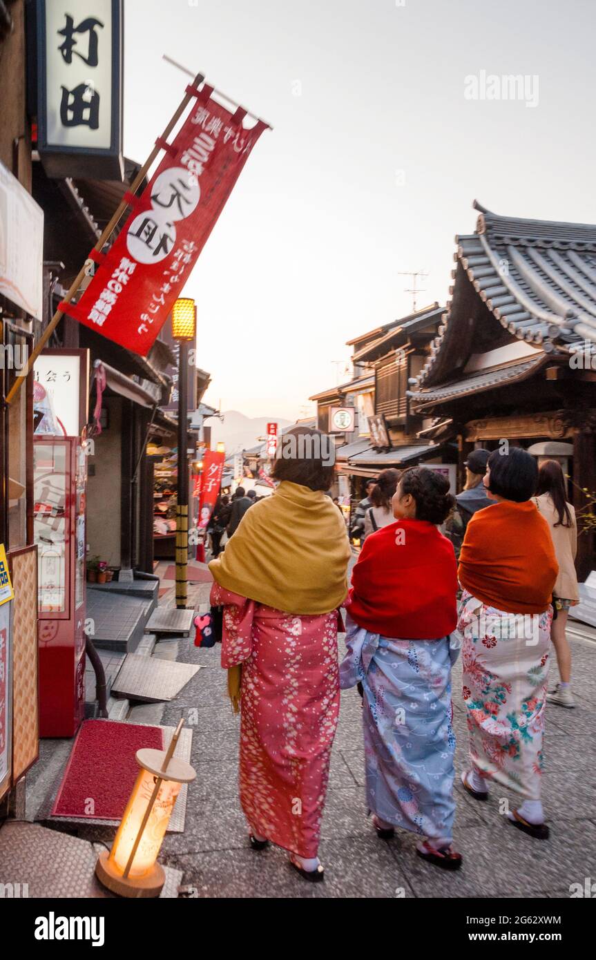 Stone paved pedestrian streets of old Kyoto during the temple lighting ceremony of Kiyomizu Temple in Japan. Stock Photo