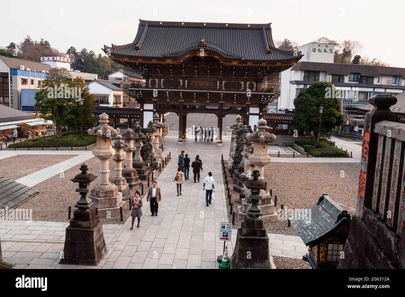 Naritasan Sinsho-ji Temple Main Gate in Narita, Japan with Japanese stone lanterns lining the path. Stock Photo