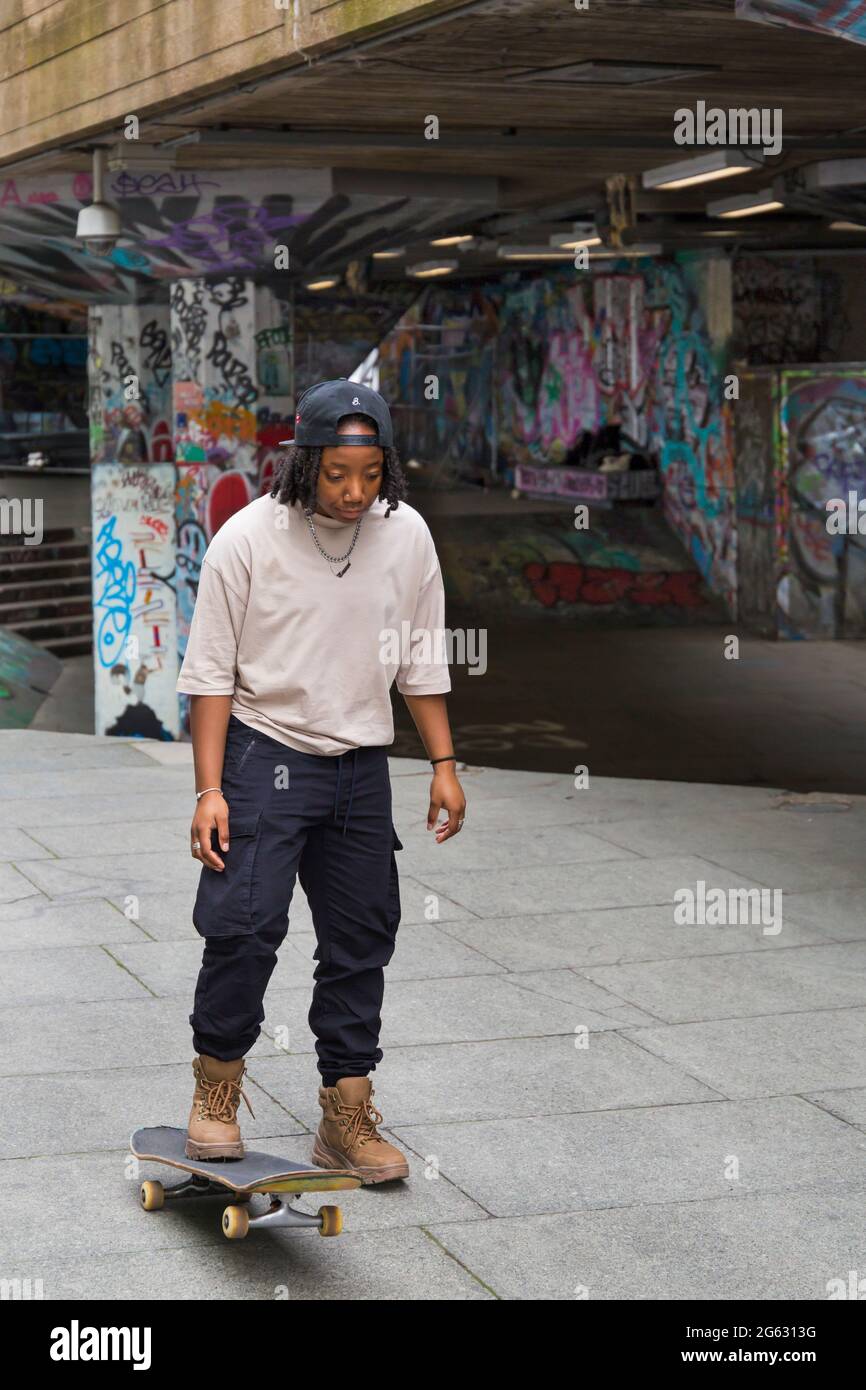 Skateboarder skateboarding at Southbank Skatepark, South Bank, London, UK in June Stock Photo