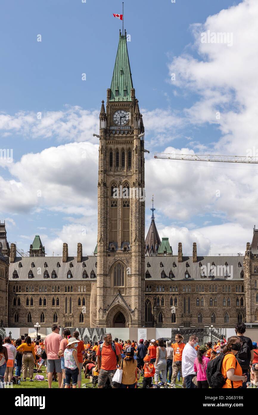 Ottawa, Canada - July 1, 2021: Cancel Canada Day protest rally on Parliament Hill in support of Indigenous people. Every Child Matters. People wearing Stock Photo