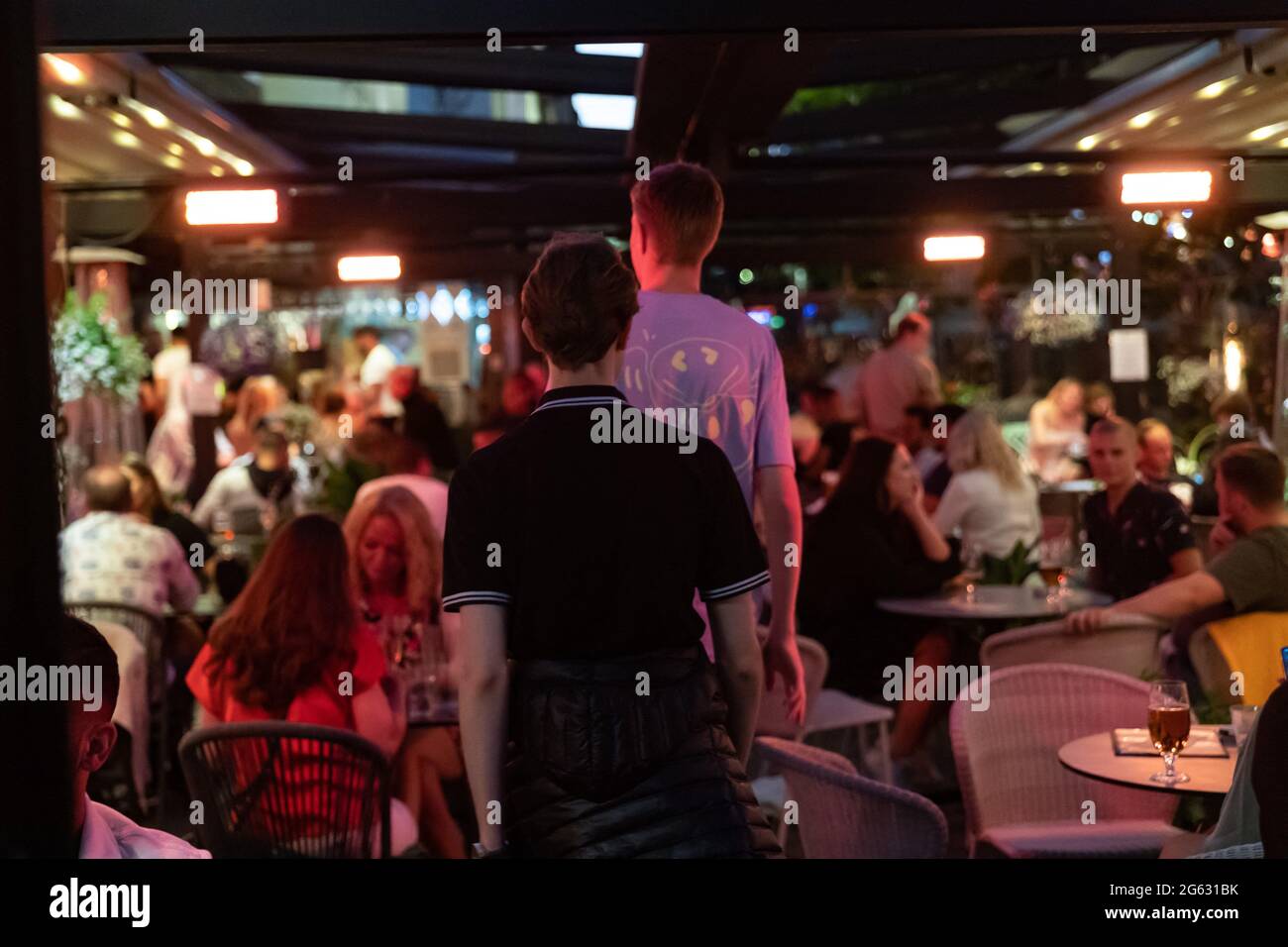 Stockholm, Sweden. 01st July, 2021. People sit at the tables outside a