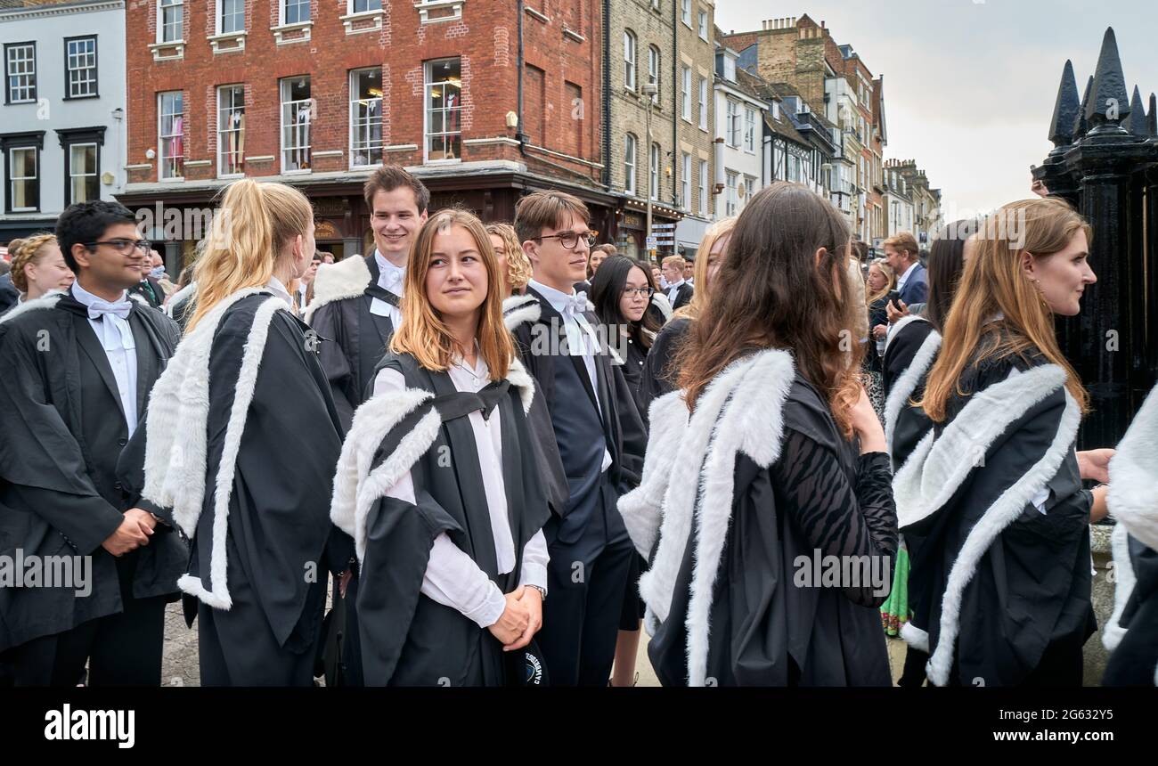 Undergraduate students from Queens' college, university of Cambridge, England, queue to enter Senate house for their graduation ceremony, 1st July 2021. Stock Photo