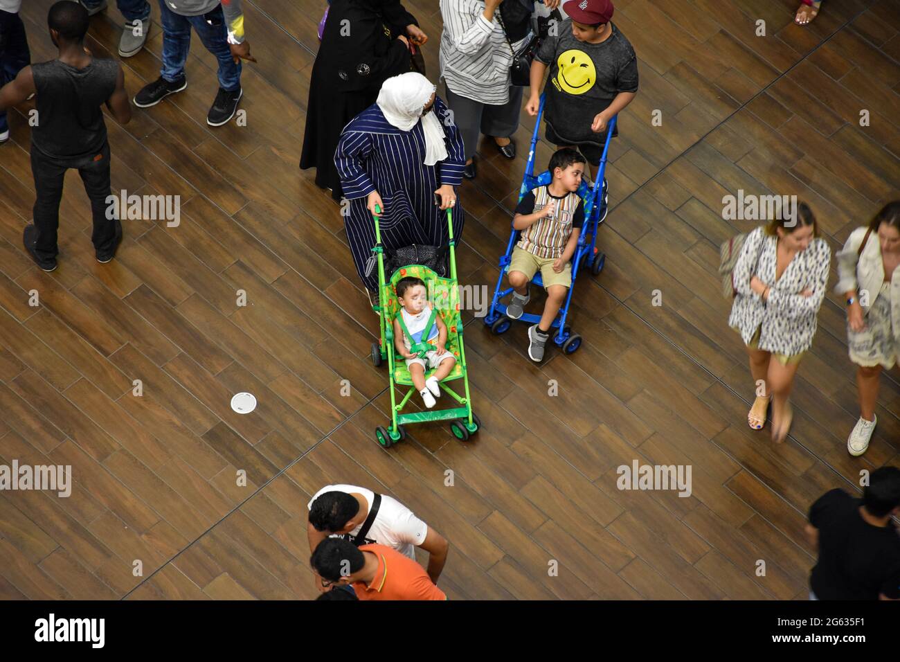 Top view of a crowd of people inside Dubai Mall. Stock Photo