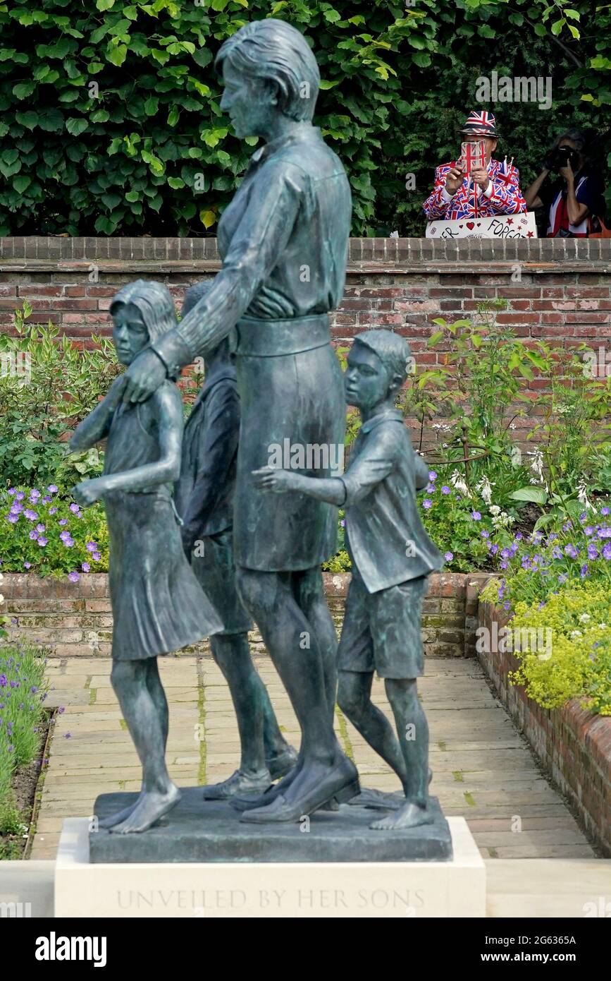 Members of the public view the statue of Diana, Princess of Wales, in