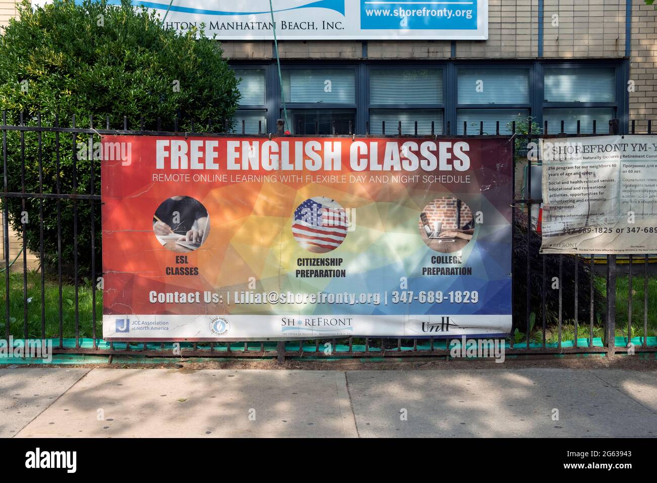A weathered sign outside the Shorefront Y in Brighton Beach Brooklyn offering free English classes, largely to the neighborhood's immigrant Russians. Stock Photo