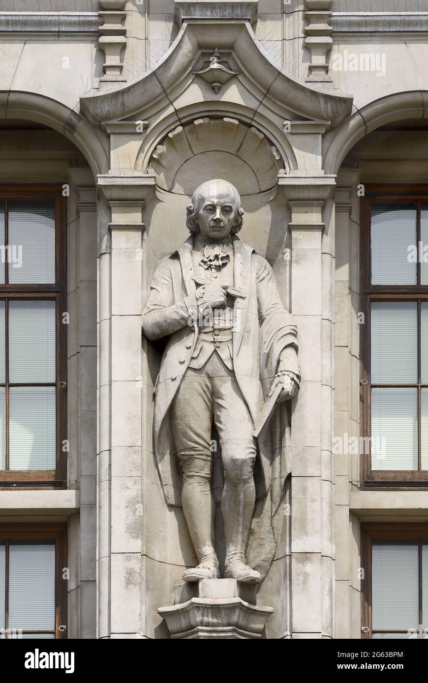 London, England, UK. Statue of John Flaxman (sculptor) by A. Bertram Pegram, on the Cromwell Road facade of the Victoria and Albert Museum, Kensington Stock Photo