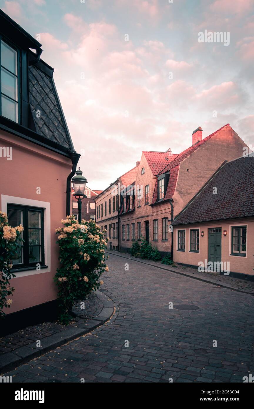 Cobblestoned street and colorful houses in old town Lund Sweden during