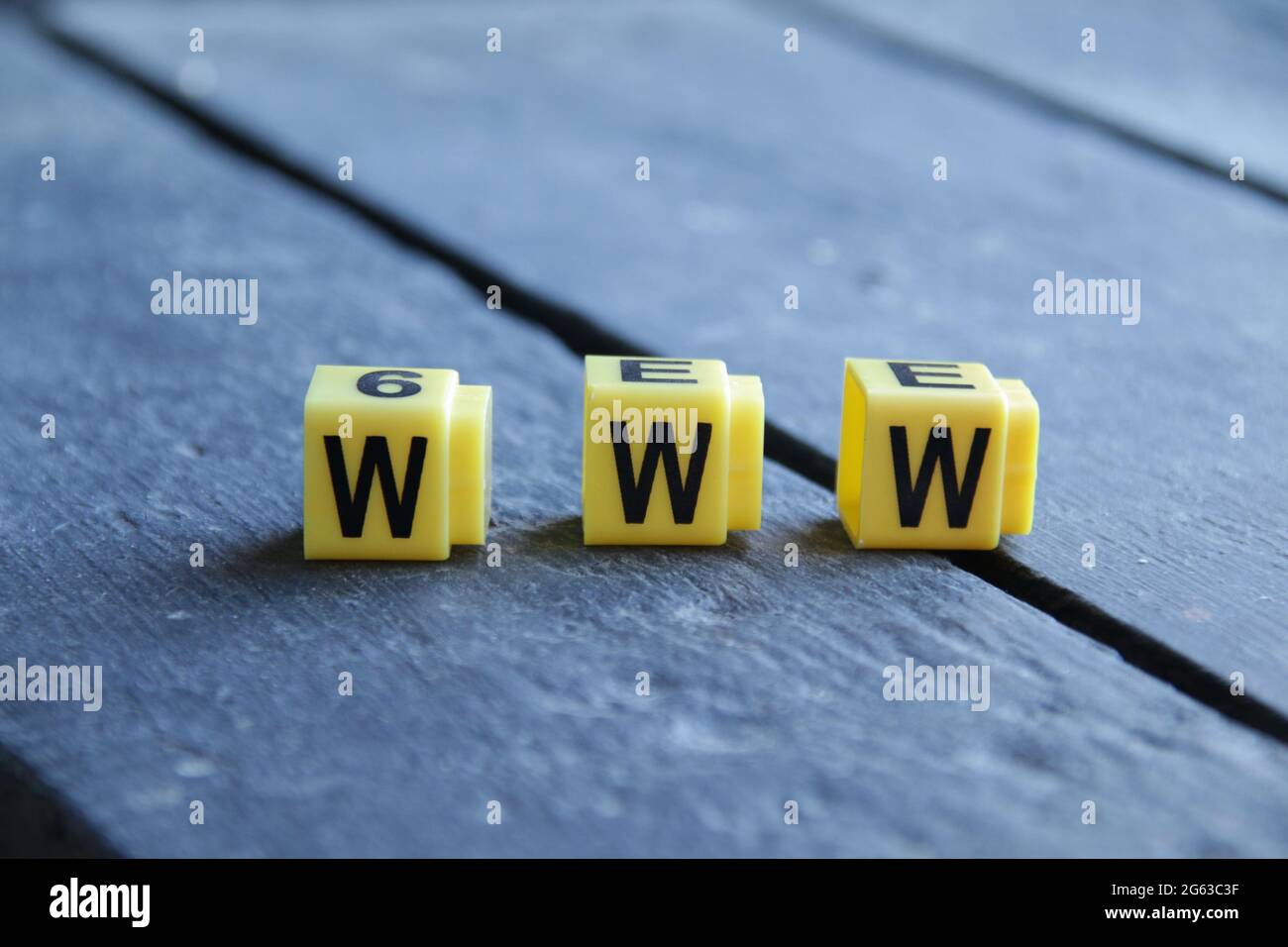 Text Www. Yellow letters on vintage background. Stock Photo