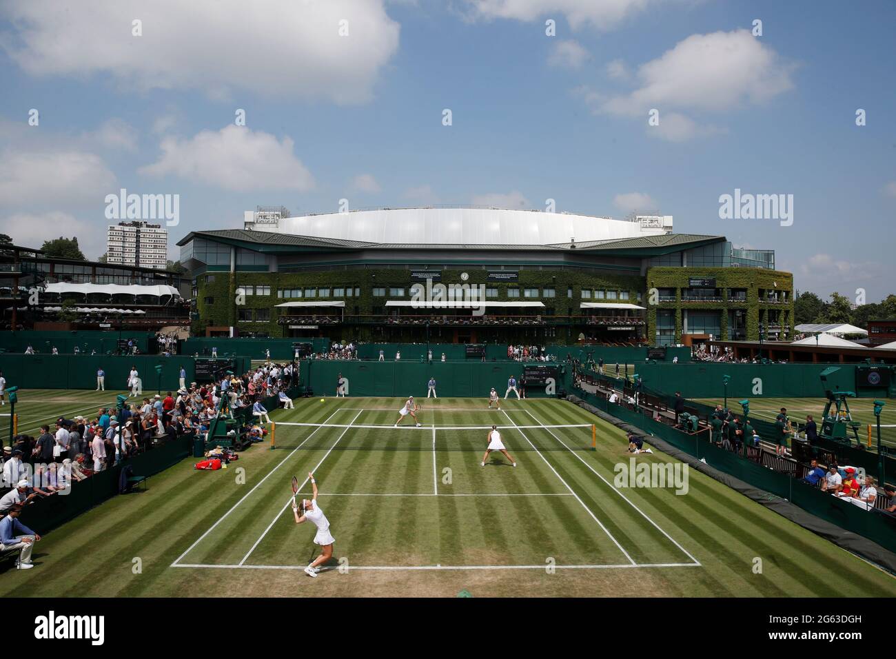 Tennis - Wimbledon - All England Lawn Tennis and Croquet Club, London,  Britain - July 2, 2021 Czech Republic's Lucie Hradecka and Marie Bouzkova  in action during their first round match against
